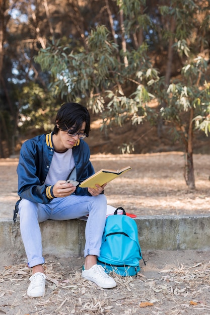 Free photo young asian student reading book