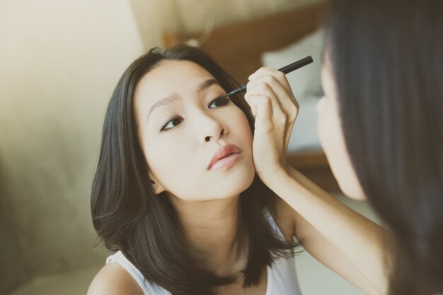 Young asian woman make up yourself