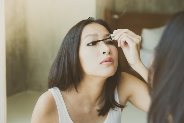 Young asian woman make up yourself