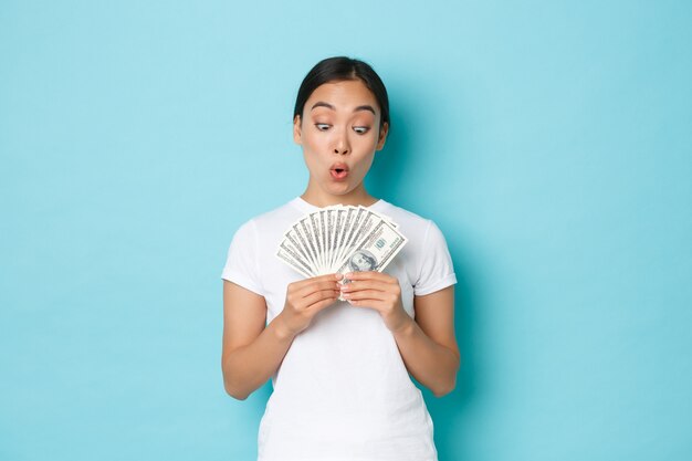 Young Asian woman wearing casual T-shirt posing