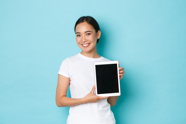 Young Asian woman wearing casual T-shirt posing