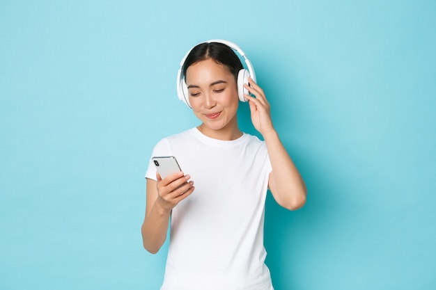 Young Asian woman wearing casual T-shirt posing