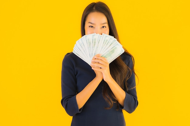 young asian woman with money