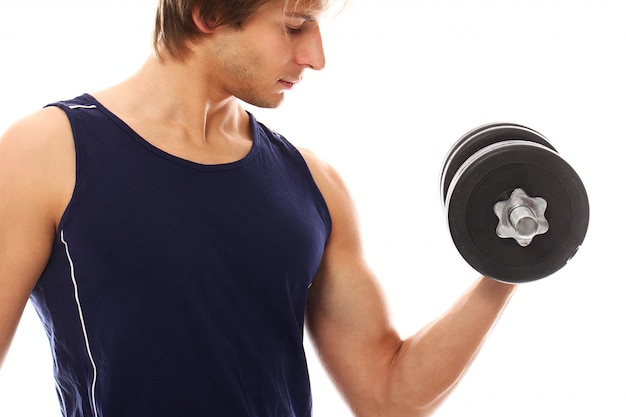 Free photo young athletic man with sportswear holding dumbbells