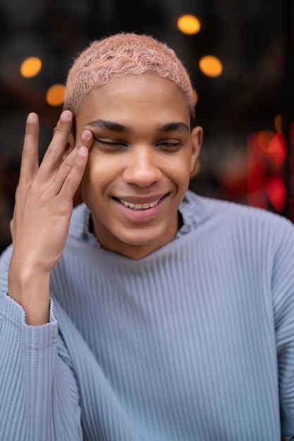 young attractive african american man in cafe, fashion shooting. Paris