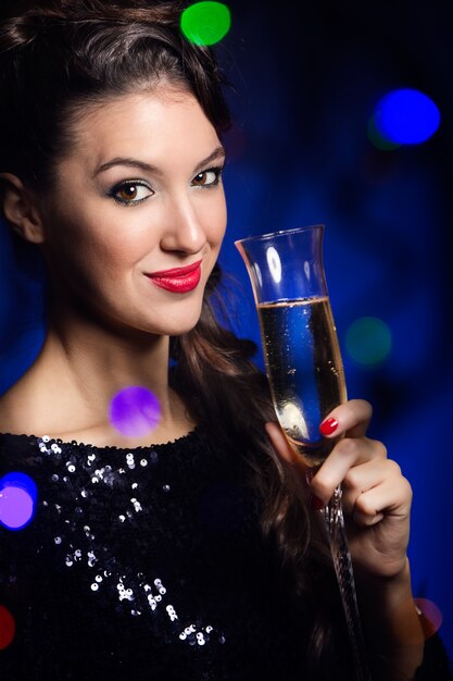 Young attractive female with champagne