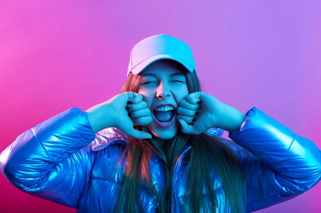 Young attractive girl in baseball cap and jacket