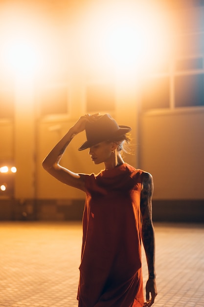 Premium Photo | A bride poses for a portrait at night