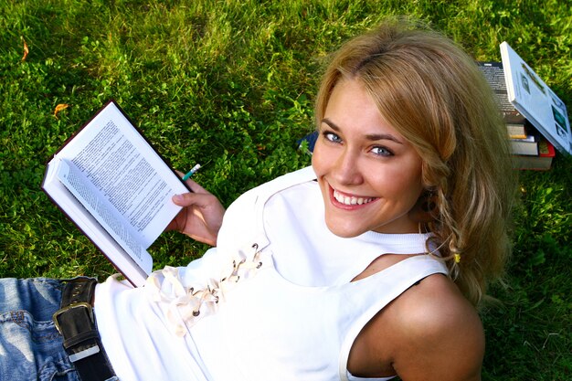 Young attractive student reading the book