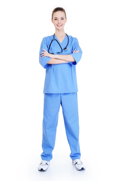 Free photo young attractive successful female surgeon standing in blue uniform