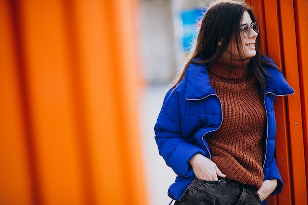 Young attractive woman in blue winter jacket