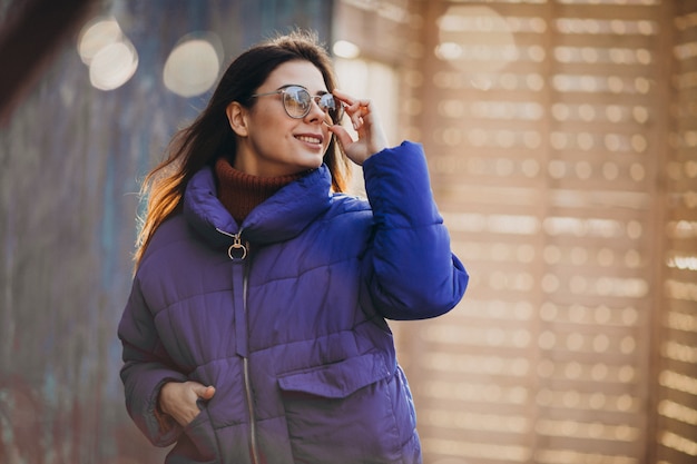 Young attractive woman in blue winter jacket