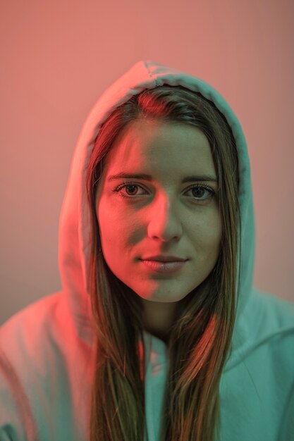 Young attractive woman in hood 