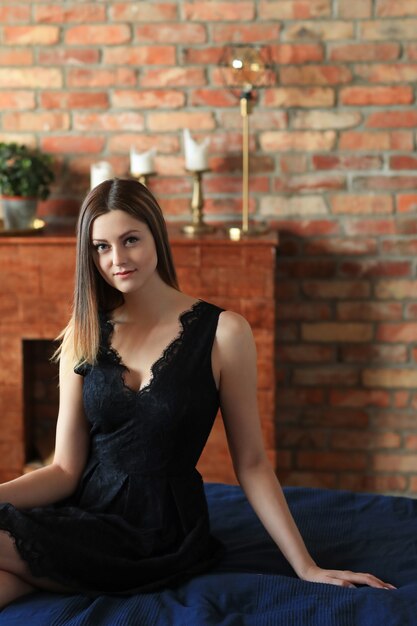 Young attractive woman posing in sofa