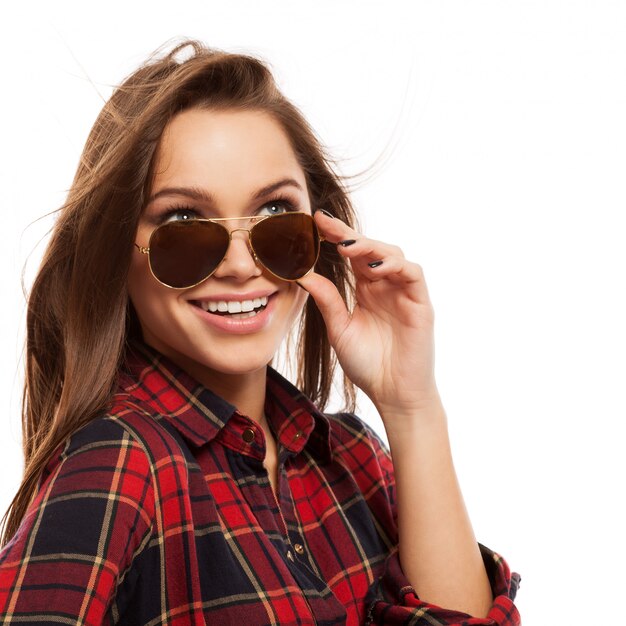 Young attractive woman in shirt and sunglasses