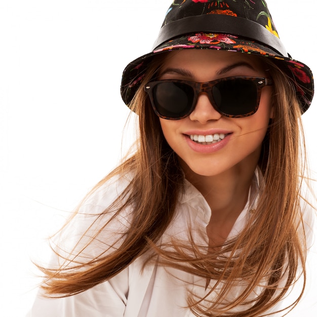 Young attractive woman in shirt and sunglasses