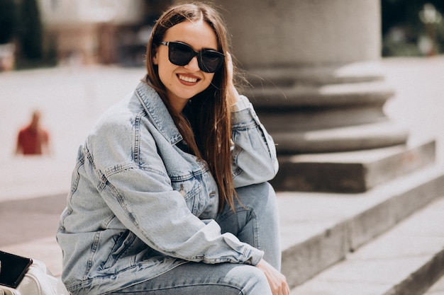 Young attractive woman sitting on stairs