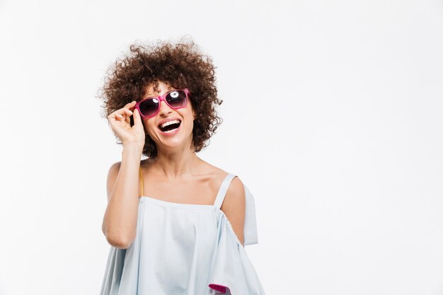 Young attractive woman in sunglasses looking