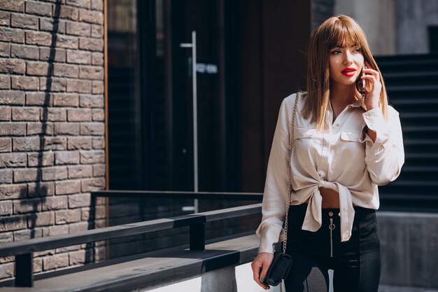 Young attractive woman talking on the phone