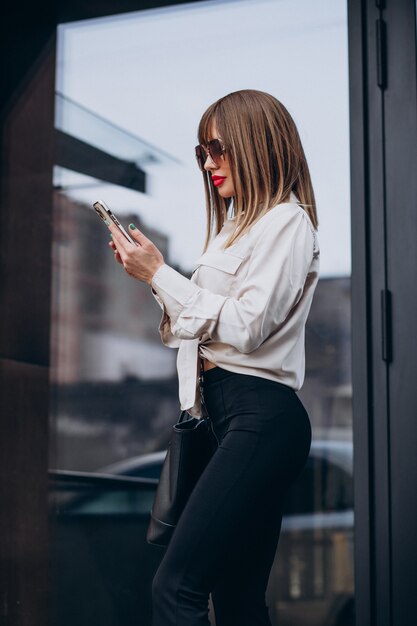 Young attractive woman talking on the phone