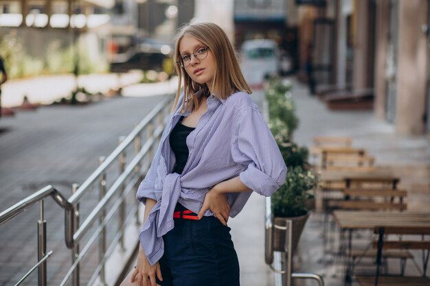 Young attractive woman walking in the street