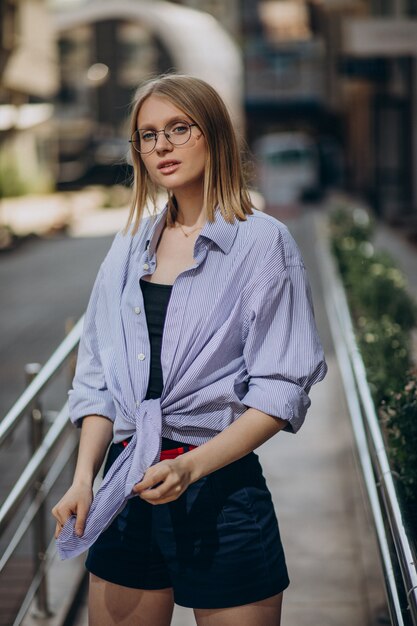 Young attractive woman walking in the street