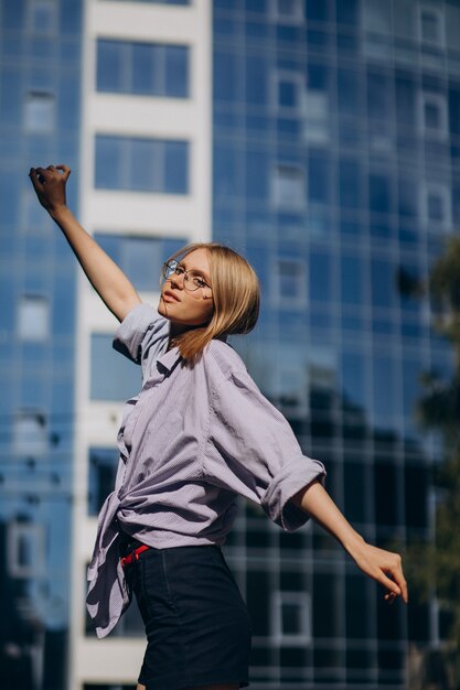 Young attractive woman walking in the street