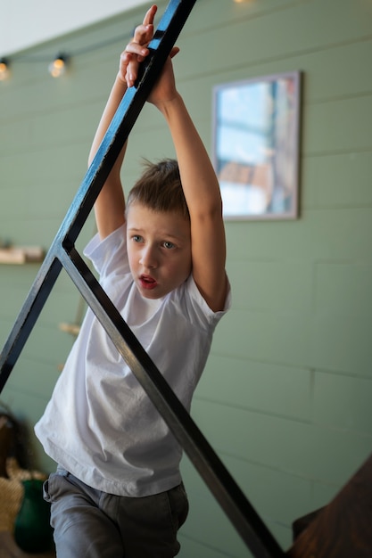 Free photo young autistic boy spending time at home indoors