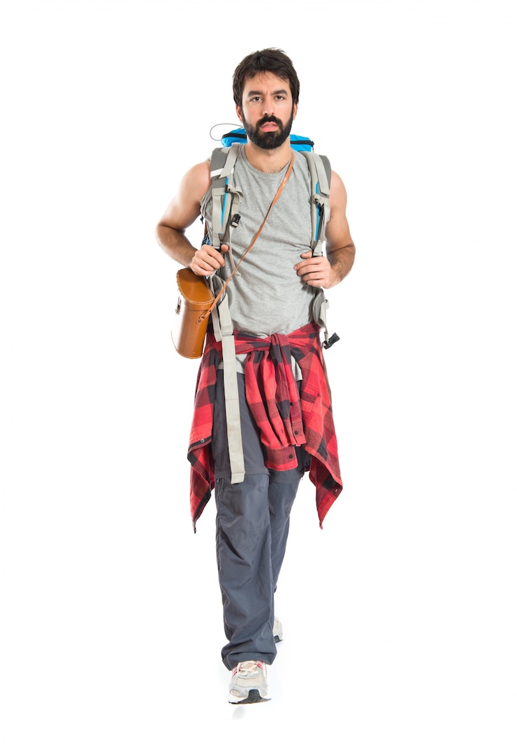 Free Photo young backpacker walking over white background