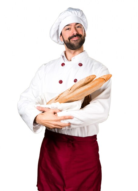 Young baker holding some bread