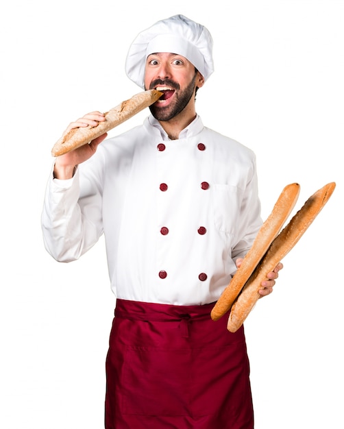 Young baker holding some bread