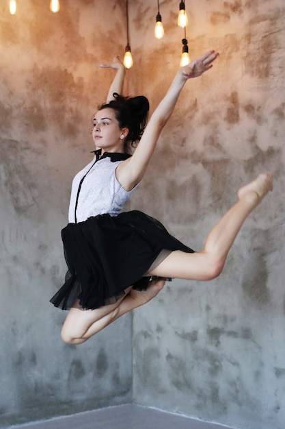 Young ballerina jumping in the air