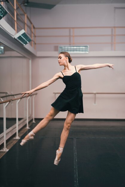 Young ballerina practising in the dance studio