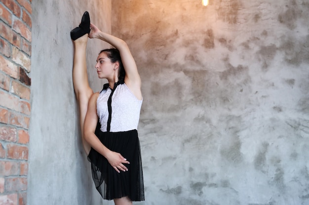 Young ballerina stretching