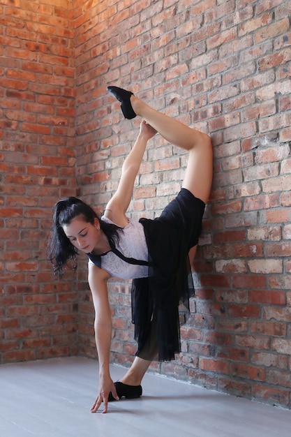 Free photo young ballerina stretching