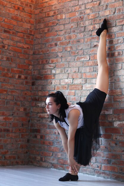 Young ballerina stretching