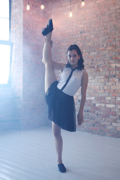 Young ballerina stretching