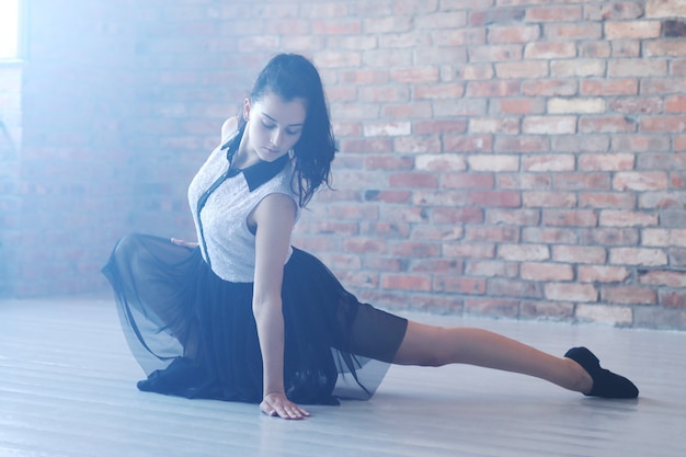 Young ballerina stretching