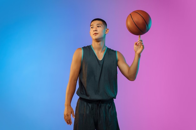 Young basketball player in neon light