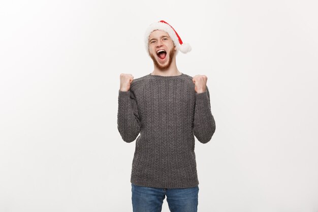 Young beard man in sweater showing hand up with exciting feeling.
