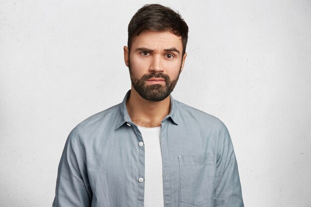 Young bearded man with denim shirt