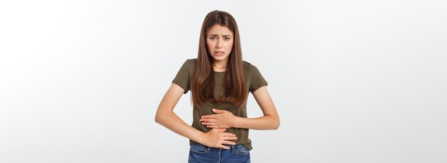 Young beautiful asian woman having painful stomachache on white background