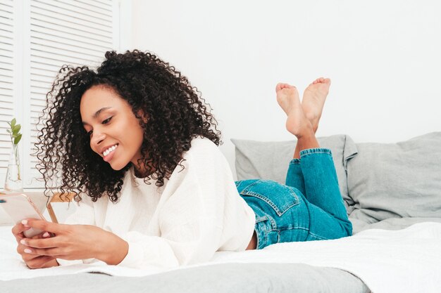 Young beautiful black female with afro curls hairstyle