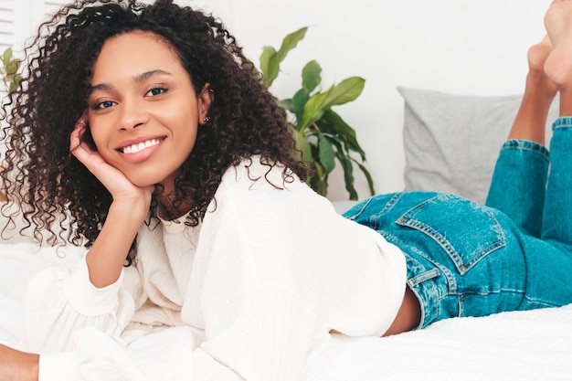 Young beautiful black female with afro curls hairstyle