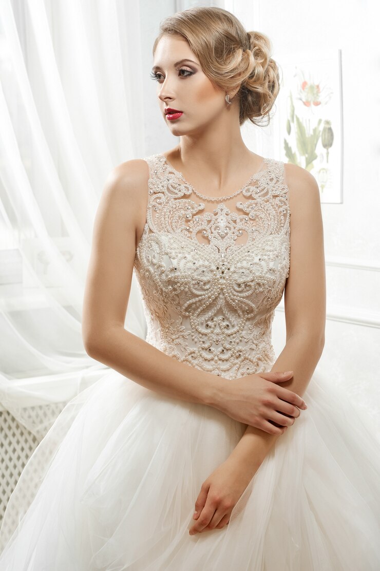 Free Photo young beautiful bride, woman in long white wedding dress on whit