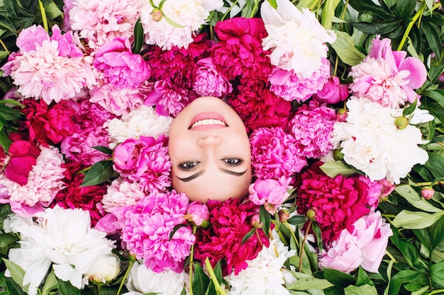 Premium Photo Young Beautiful Brunette Woman Model With Beautiful Makeup And Long Hair In Pink Colors Peonies Premium Photo Young Beautiful Brunette Woman Model With Beautiful Makeup And Long Hair In Pink Colors Peonies