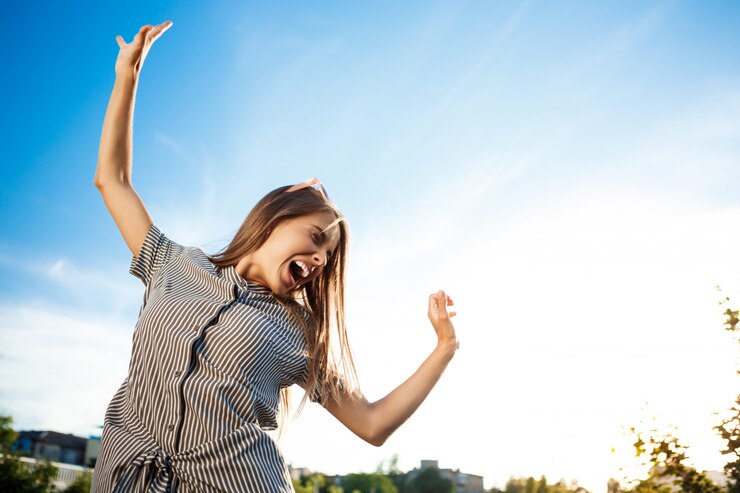 Free Photo young beautiful cheerful woman walking around city, smiling, rejoicing.