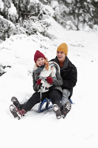 Young beautiful couple having fun and having a blanket