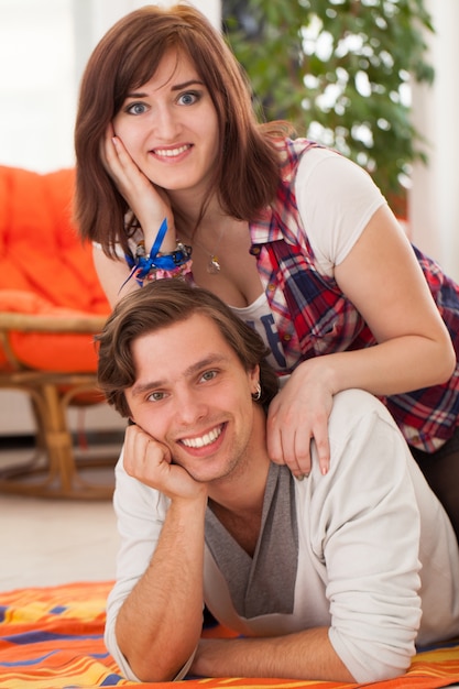 Young beautiful couple at home