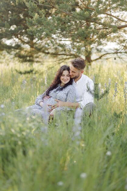 Young beautiful couple spend time in the garden